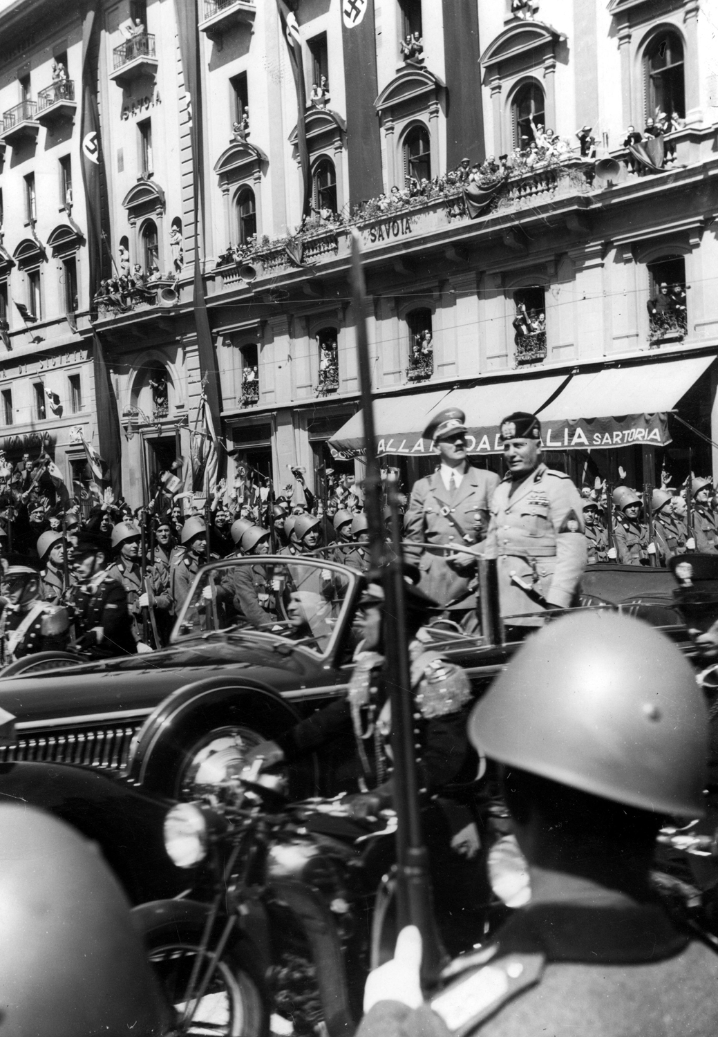 Adolf Hitler and Benito Mussolini cross the Italian city of Florence
